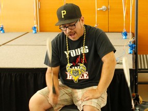 Nicole Auger/Daily Herald-Tribune
Grande Prairie Powwow president Walter White drums and sings a song during the Grand Entry of Grande Prairie Friendship Centre's Aboriginal Head Start 2017 Graduation at Teresa Sargent Hall on Thursday June 15, in Grande Prairie.