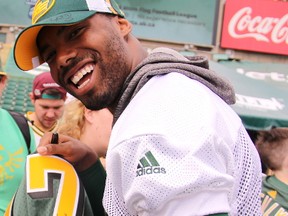 Eskimos wide receiver Shamawd Chambers signs autographs during Eskimos Fan Day at Commonwealth Stadium in Edmonton on Tuesday, July 4, 2017.