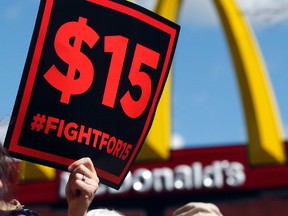 Supporters of a $15 minimum wage for fast food workers rally in front of a McDonald's in Albany, N.Y., on July 22, 2015. (Mike Groll/AP Photo/Files)