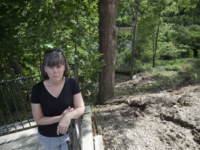 Londoner Susan Skelton is upset that a Hampton Crescent neighbour  has removed a large amount of trees and foliage from their riverbank property. (Derek Ruttan/The London Free Press)