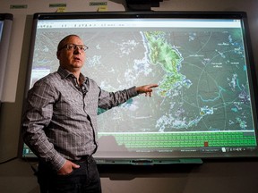Meteorologist Dan Kulak explains radar footage of Tuesday night's storm during a media tour of the Meteorological Service of Canada (MSC) weather forecast operations in Edmonton, Alta., on Wednesday, June 21, 2017.