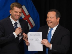 (left to right) Wildrose Party leader Brian Jean and Alberta PC leader Jason Kenney announce that they have reached a deal to merge the parties and create the United Conservative Party, during a press conference in Edmonton Thursday May 18, 2017.