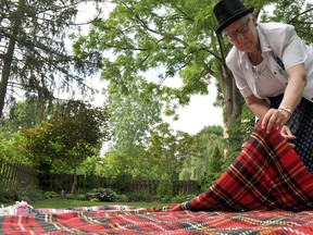 Sister Kathleen Lichti stands next to a couple of blankets she uses when facilitating the KAIROS Blanket Exercise, an interactive workshop designed to teach participants about the history of indigenous cultures in Canada. CHRIS MONTANINI\LONDONER\POSTMEDIA NETWORK