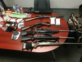 Police seized drugs, weapons and cash after executing a warrant in Parkland County on June 20, 2017.  SUPPLIED