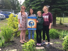 BRUCE BELL/THE INTELLIGENCER 
St. Mary Catholic School in Read was recently awarded platinum status in the Ontario EcoSchools program  for its environmental stewardship practices. Pictured (from left) are team members (staff) Josie Fitzgerald with Grade 8 Eco team mentors Olivia Hiscoe-Dillon, Emma Phieffer and Hannah Way in the school's butterfly garden.