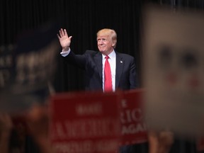 President Donald Trump arrives for a rally on June 21, 2017 in Cedar Rapids, Iowa. Trump spoke about renegotiating NAFTA and building a border wall that would produce solar power during the rally. (Photo by Scott Olson/Getty Images)