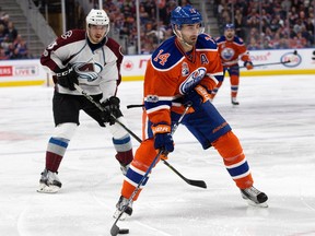 The Edmonton Oilers' Jordan Eberle (14) battles the Colorado Avalanche during first period NHL action at Rogers Place, in Edmonton on Saturday, March 25, 2017.