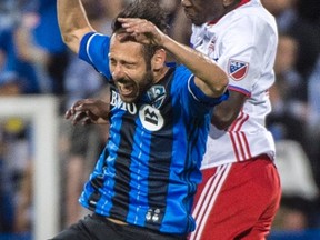 Toronto FC’s Chris Mavinga heads a ball away from Montreal’s Matteo Mancosu on Wednesday. (THE CANADIAN PRESS)