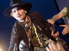 Actor Johnny Depp introduces his film, The Libertine, to the audience at 'Cineramageddon', the outdoor cinema venue, at the Glastonbury Festival of Music and Performing Arts June 22, 2017(OLI SCARFF/AFP/Getty Images)