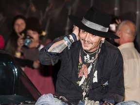 Actor Johnny Depp arrives at the Glastonbury music festival at Worthy Farm, in Somerset, England, Thursday, June 22, 2017. (Photo by Grant Pollard/Invision/AP)