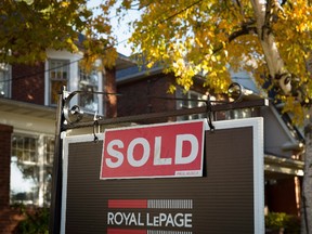 A real estate sold sign hangs in front of a west-end Toronto property, Friday, Nov. 4, 2016 as the mayor of Toronto is expresses concern at the latest data on the city's hot housing market that shows home prices continue to soar. THE CANADIAN PRESS/Graeme Roy