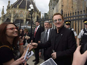 Bono, shown here on his 2015 to Ottawa, returns on Canada Day with bandmate The Edge to do a tune. (Justin Tang, The Canadian Press)