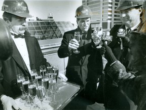 Vice-president Paul Campbell, centre and London Mayor Tom Gosnell are served champagne by Mark Gorden during a ceremony to mark the completion of work on Galleria London's exterior, 1989. (London Free Press files)