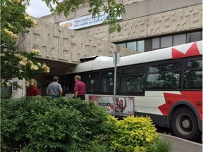 An OC Transpo bus is shown wedged into the main entrance of CHEO Friday, June 23. @DEENASIF VIA TWITTER