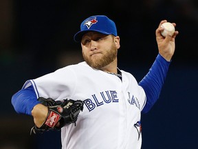 Blue Jays starter Mark Buehrle delivers against the Houston Astros at the Rogers Centre in Toronto Tuesday April 8, 2014. (Craig Robertson/Toronto Sun)