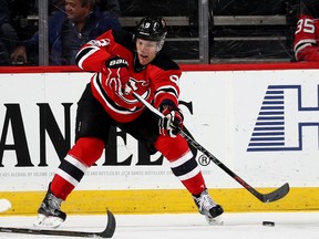 Taylor Hall of the New Jersey Devils passes the puck in the first period against the Carolina Hurricanes on March 25, 2017 at Prudential Center in Newark, New Jersey. (Photo by Elsa/Getty Images)