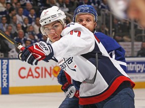T.J. Oshie of the Washington Capitals tries to break free from Leo Komarov of the Toronto Maple Leafs at the Air Canada Centre on April 23, 2017 in Toronto. (Claus Andersen/Getty Images)