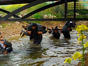 In this photo released on April 30, 2015 by a militant website, which has been verified and is consistent with other AP reporting, new recruits of the Islamic State train in Mosul, northern Iraq. (Militant website via AP)