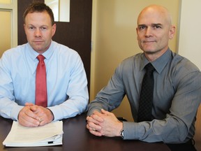 Sgt. Geoff Dempster, left, and Staff-Sgt. Chris Scott of the Kingston Police Quality Assurance and Professional Standards unit. (Steph Crosier/The Whig-Standard)