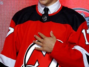 Nico Hischier poses for photos after being selected first overall by the New Jersey Devils during the 2017 NHL Draft at the United Center on June 23, 2017 in Chicago, Illinois. (Bruce Bennett/Getty Images)