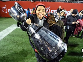 After winning the Grey Cup last season, Redblacks linebacker Damaso Munoz decided to return and spend more time with his family, including son Maddix. (The Canadian Press)