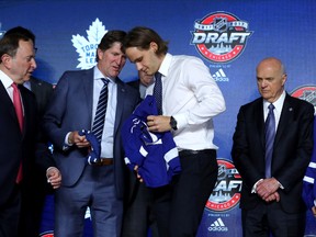 Timothy Liljegren puts on the Toronto Maple Leafs jersey after being selected 17th overall during the 2017 NHL Draft at the United Center on June 23, 2017 in Chicago, Illinois. (Bruce Bennett/Getty Images)
