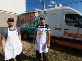 Edwin Badong and  Rodel Luquingan run the new Hope Mission Food Truck as it is unveiled  at the Hope Mission's Youth Centre on Friday June 23, 2017, in Edmonton.