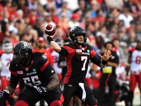 Redblacks quarterback Trevor Harris (7) throws the ball against the Stampeders during first quarter CFL action in Ottawa on Friday, June 23, 2017. (THE CANADIAN PRESS/Justin Tang)
