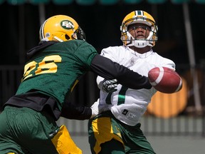 Linebacker Chris Edwards (left) slaps a pass away from wide receiver KJ Maye during Edmonton Eskimos practice at Commonwealth Stadium in Edmonton, Alberta on Thursday, June 22, 2017. The team plays their first regular season game on the road against the BC Lions on Saturday.