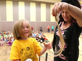 Kindergarten student Sophie Hoag, 5, shows some of the hair she had cut off at a school assembly at Ecole publique Foyer-Jeunesse in Hanmer, Ont. on Friday June 23, 2017. The little girl had more than 36 centimetres (14.5 inches) of her hair cut off in support of NEO Kids Foundation and kids with cancer. She came up with the compassionate gesture after watching television and seeing images of hospitalized children who had lost their hair. Her mother explained to her that cancer treatments can have that side effect. Her hair will be donated too Wigs for Kids and the funds she and her school raised will go to the NEO Kids Foundation. Almost $2,300 was raised. John Lappa/Sudbury Star/Postmedia Network