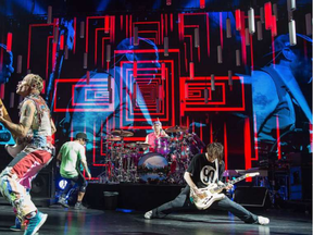 Band members Anthony Kiedis, Flea, Chad Smith and Josh Klinghoffer on stage as the Red Hot Chili Peppers perform at Canadian Tire Centre. (Wayne Cuddington, Ottawa Citizen)