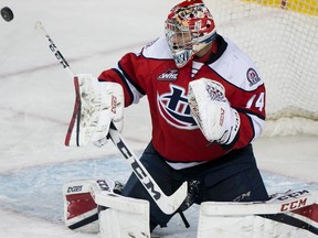 Stuart Skinner makes a save off the tip of his stick as the Calgary Hitmen took on the Lethbridge Hurricanes at the Scotiabank Saddledome in Calgary, Alta., on March 10, 2017.