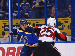 St. Louis Blues' Ryan Reaves, left, fights with Ottawa Senators' Chris Neil during the first period of an NHL hockey game, Tuesday, Jan. 17, 2017, in St. Louis. (AP Photo/Billy Hurst)