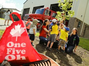 Children from Northern Lights Daycare prepare to assist Tracy Logan of Logan Tree Experts plant an Autumn Blaze maple tree on Wednesday June 21, 2017 during the Canada 150 Tree Planting Ceremony outside the Otonabee-South Monaghan Townships's fire station in Keene, Ont. Logan provided a teaching session for the students to learn about proper tree care and signs to look for when a tree is struggling. The Canada 150 tree will be the first tree into the Green Leaf Challenge for the township, earning OSM their first badge in the challenge. Take home tips were given to community members to encourage them to take the challenge back home. Canada 150 intern Melissa Hewitt and public education and administrative assistant also attended the ceremony. (CLIFFORD SKARSTEDT/PETERBOROUGH EXAMINER)