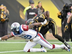 Montreal Alouettes receiver S.J. Green scores a touchdown past Hamilton Tiger-Cats defensive back Brandon Stewart during first quarter action in the CFL Eastern Division final in Hamilton, Ont., on Sunday, Nov. 23, 2014. It's been a long road back for S.J. Green.The veteran receiver will make his Toronto debut Sunday afternoon when the Argonauts host the arch-rival Hamilton Tiger-Cats at BMO Field. (THE CANADIAN PRESS/Nathan Denette)