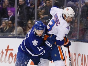 The Leafs were in on talks for defenceman Travis Hamonic (right), but he eventually went to the Calgary Flames. (Stan Behal/Toronto Sun)