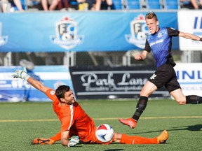 Edmonton's Dean Shiels can't get the ball past San Francisco's Romuald Peiser during FC Edmonton's NASL soccer game against the San Francisco Deltas at Clarke Stadium in Edmonton, Alta., on Saturday, June 24, 2017.