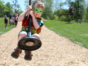 Four-year-old Joshua Liddle dressed up as comic book superhero Robin for his first ride on the new zip line at the Batawa Lions Natural Community Park on Saturday June 24, 2017 in Batawa, Ont. Tim Miller/Belleville Intelligencer/Postmedia Network
