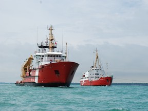 The CCGS Samuel Risley in Lake St. Clair moves alongside the Alexander Henry, a former Coast Guard vessel the Samuel Risley replaced after the elder vessel was decommissioned in 1984. The Alexander Henry is on its way to Thunder Bay where it's to become a tourist attraction. (Photo courtesy of the Canadian Coast Guard)