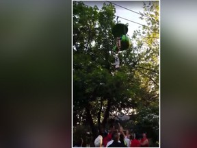 Screengrab of video showing a girl at Six Flags Amusement Park in New York, falling from a stopped gondola ride on Saturday, June 24, 2017. (Loren Ent/Facebook)