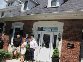 Homeowner Gerry Legault, left, Sarnia City Coun. Anne Marie Gillis, and Sarnia Heritage Committee Chairperson Greg Ross, pose at the unveiling of a heritage plaque for Sarnia's historic Skilbeck house Saturday. The home is one of the oldest in Sarnia and was the site of Canada's first trust company. Tyler Kula/Sarnia Observer/Postmedia Network