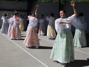 Susan Cagumbay is one of 14 dancers in Fiesta Filipina, performing at this year's Canada Day celebration in Canatara Park. The annual event in Sarnia features multicultural performances and food. Tyler Kula/Sarnia Observer/Postmedia Network