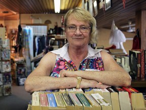 Joanne Lefebvre, owner of Joanne's Curiosity Shoppe at Pickers World Antique Market, at the market on Saturday. A former prison librarian, she said it was a tragedy to learn some books had been destroyed in a recent fire at the antique market. (Steph Crosier/The Whig-Standard)
