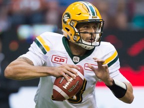 Edmonton Eskimos' quarterback Mike Reilly looks for a receiver during the first half of a CFL football game against the B.C. Lions in Vancouver, B.C., on Saturday, June 24, 2017.