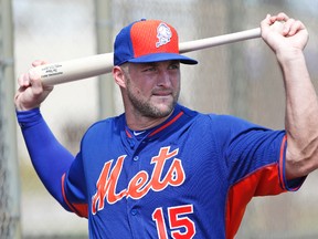 In this Sept. 19, 2016, file photo, New York Mets' Tim Tebow stretches out before batting practice at the team's complex in Port St. Lucie, Fla.. (AP Photo/Wilfredo Lee, File)