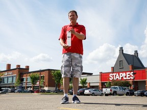 Kevin Hicks is photographed in the parking lot where he got a ticket in Oliver Square in Edmonton on Sunday, June 25, 2017. (Codie McLachlan/Postmedia)