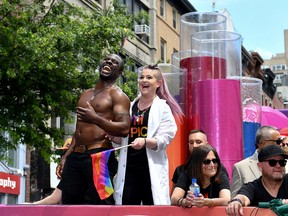 Gbenga Akinnagbe (L) Kelly Osbourne ride the amfAR #BeEpicEndAIDS float during the 2017 New York City Pride March on June 25, 2017 in New York City. (Photo by Dia Dipasupil/Getty Images)