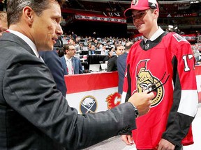 Ottawa Senators fourth-round selection Drake Batherson meets head coach Guy Boucher at the 2017 NHL draft last weekend in Chicago. His father, Norm Batherson, is a former Belleville Bull. (Postmedia photo)