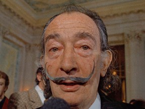In this May 21, 1973 file photo, Spanish surrealist painter Salvador Dali, presents his first Chrono-Hologram in Paris, France. (AP Photo/Eustache Cardenas, File)