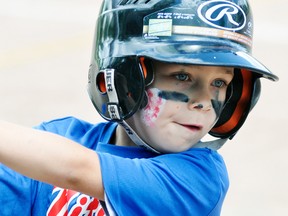 Seth Brown of the Mitchell Minor Rookie (Harris) squad looks the part with eye black and a painted baseball on his face during Mitchell Minor Baseball Day Sunday, June 25. ANDY BADER/MITCHELL ADVOCATE